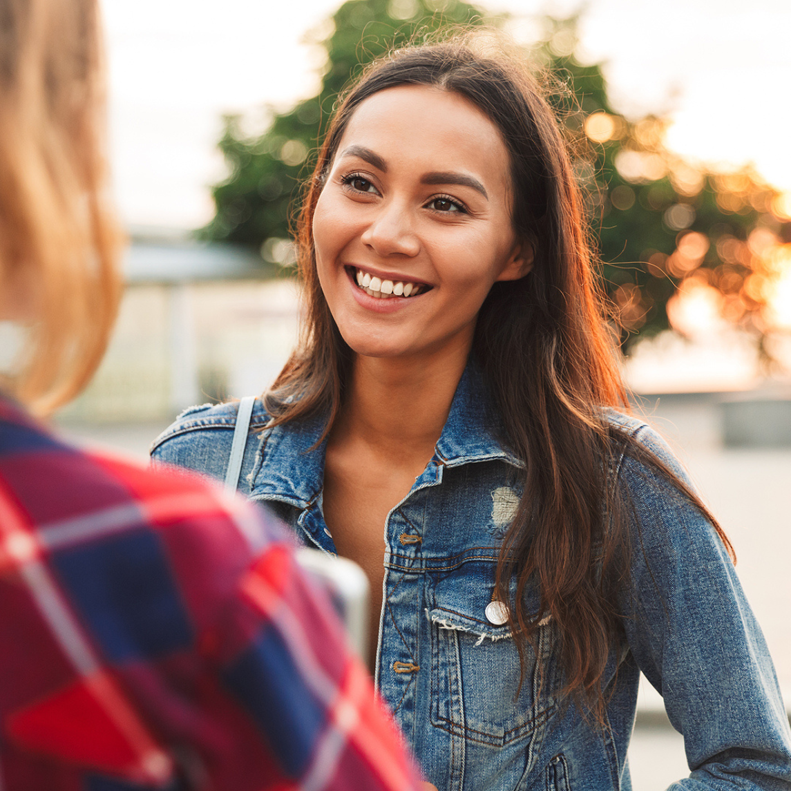 girl smiling A woman holding a free pregnancy test in Wyandotte and Olathe, Kansas
