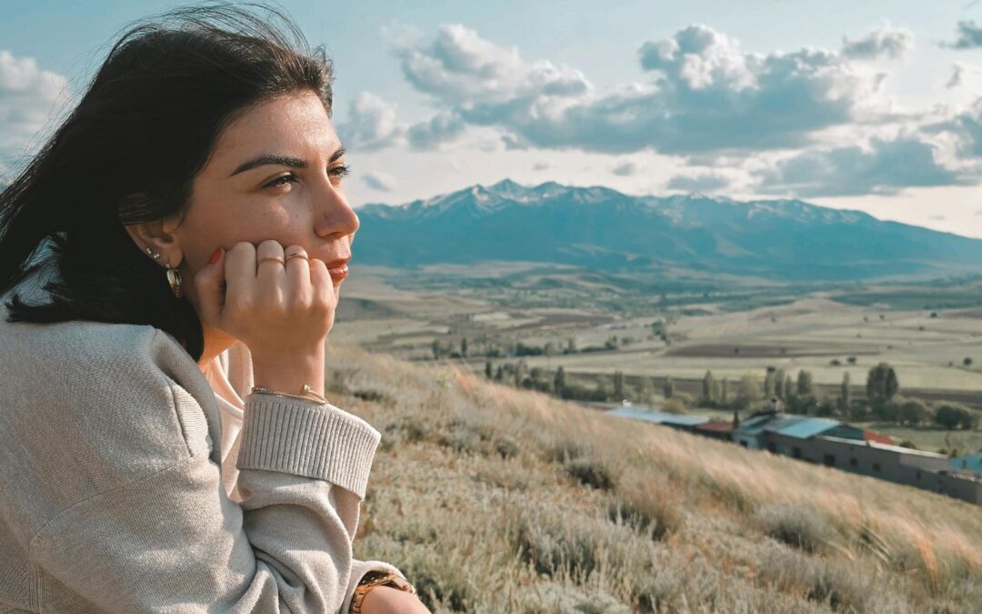 woman outside looking off in the distance